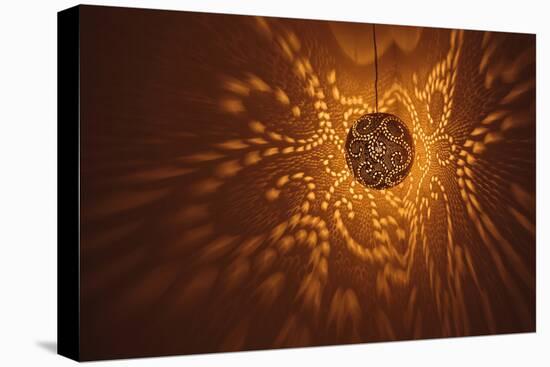 India, Rajasthan, Jaisalmer. Pierced Lamp and Shadows Against Wall-Alida Latham-Stretched Canvas