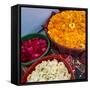 India, Rajasthan, Pipar. vendor making necklaces of marigolds and roses-Alison Jones-Framed Stretched Canvas