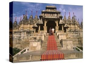 India, Rajasthan, Ranakpur, a Couple Descend Steps at the Famous Chaumukha Mandir, an Elaborately S-Amar Grover-Stretched Canvas