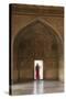 India, Uttar Pradesh, Agra, Agra Fort, a Woman in a Red Saree Walks Through the Interior-Alex Robinson-Stretched Canvas