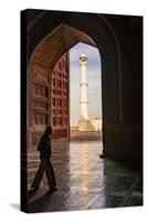 India, Uttar Pradesh. Agra. Taj Mahal minaret framed by mosque arch-Alison Jones-Stretched Canvas
