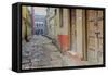 India, Varanasi a Man Walking Down a Stone Tiled Street in the Downtown Area-Ellen Clark-Framed Stretched Canvas