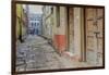 India, Varanasi a Man Walking Down a Stone Tiled Street in the Downtown Area-Ellen Clark-Framed Photographic Print