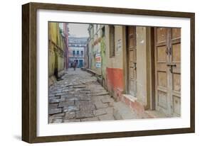 India, Varanasi a Man Walking Down a Stone Tiled Street in the Downtown Area-Ellen Clark-Framed Photographic Print