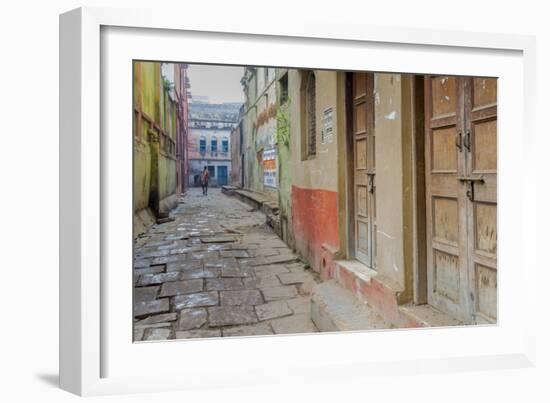 India, Varanasi a Man Walking Down a Stone Tiled Street in the Downtown Area-Ellen Clark-Framed Photographic Print