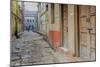 India, Varanasi a Man Walking Down a Stone Tiled Street in the Downtown Area-Ellen Clark-Mounted Photographic Print