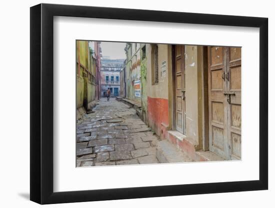 India, Varanasi a Man Walking Down a Stone Tiled Street in the Downtown Area-Ellen Clark-Framed Photographic Print