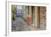 India, Varanasi a Man Walking Down a Stone Tiled Street in the Downtown Area-Ellen Clark-Framed Photographic Print