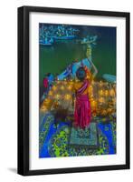 India, Varanasi Young Boy in Pink and Yellow Robes Holds Up an Offering to the Ganges River-Ellen Clark-Framed Photographic Print