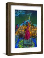 India, Varanasi Young Boy in Pink and Yellow Robes Holds Up an Offering to the Ganges River-Ellen Clark-Framed Photographic Print