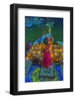 India, Varanasi Young Boy in Pink and Yellow Robes Holds Up an Offering to the Ganges River-Ellen Clark-Framed Photographic Print