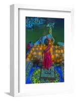 India, Varanasi Young Boy in Pink and Yellow Robes Holds Up an Offering to the Ganges River-Ellen Clark-Framed Photographic Print