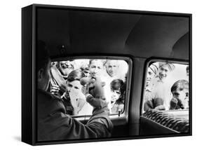 Indian children looking into puppeteer Bil Baird's car, March 1962.-James Burke-Framed Stretched Canvas