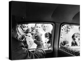 Indian children looking into puppeteer Bil Baird's car, March 1962.-James Burke-Stretched Canvas