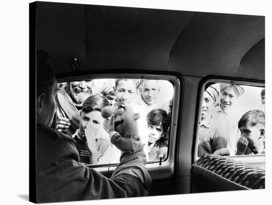 Indian children looking into puppeteer Bil Baird's car, March 1962.-James Burke-Stretched Canvas