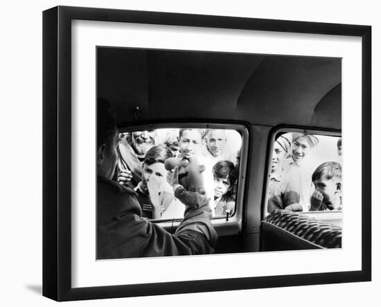 Indian children looking into puppeteer Bil Baird's car, March 1962.-James Burke-Framed Premium Photographic Print