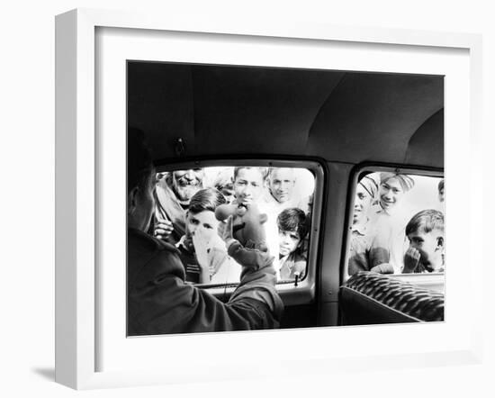 Indian children looking into puppeteer Bil Baird's car, March 1962.-James Burke-Framed Premium Photographic Print