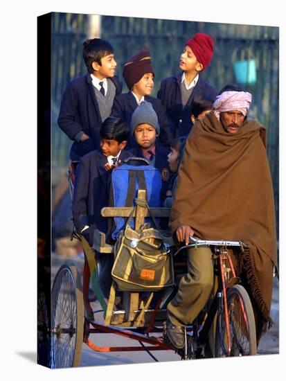 Indian Children Ride to School on the Back of a Cycle Rickshaw-null-Stretched Canvas