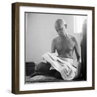 Indian Leader Mohandas Gandhi Reading as He Sits Cross Legged on Floor, at Home-Margaret Bourke-White-Framed Premium Photographic Print