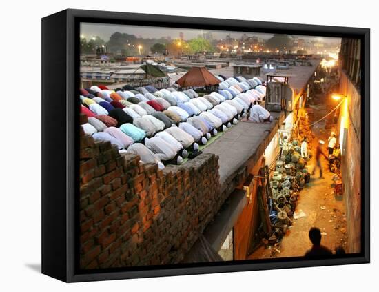 Indian Muslims During Friday Evening Prayers on the Rooftop of a Building over an Auto Parts Market-null-Framed Stretched Canvas