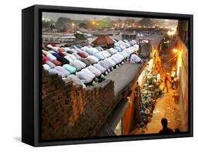 Indian Muslims During Friday Evening Prayers on the Rooftop of a Building over an Auto Parts Market-null-Framed Stretched Canvas