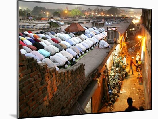 Indian Muslims During Friday Evening Prayers on the Rooftop of a Building over an Auto Parts Market-null-Mounted Photographic Print