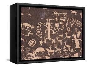 Indian Petroglyphs Drawn on Red Standstone by Scratching Away Dark Desert Varnish of Iron Oxides-Tony Waltham-Framed Stretched Canvas