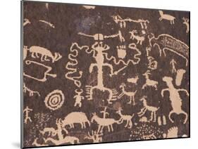 Indian Petroglyphs Drawn on Red Standstone by Scratching Away Dark Desert Varnish of Iron Oxides-Tony Waltham-Mounted Photographic Print
