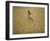 Indian Village Boy Runs Through a Parched Field on World Water Day in Berhampur, India-null-Framed Photographic Print