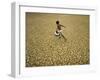 Indian Village Boy Runs Through a Parched Field on World Water Day in Berhampur, India-null-Framed Photographic Print