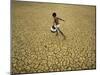 Indian Village Boy Runs Through a Parched Field on World Water Day in Berhampur, India-null-Mounted Photographic Print