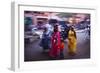 Indian women in colourful saris walk along streets-Charles Bowman-Framed Photographic Print