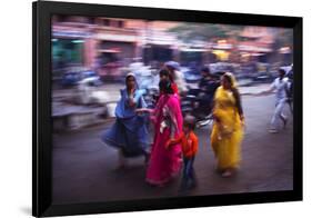 Indian women in colourful saris walk along streets-Charles Bowman-Framed Photographic Print