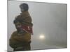 Indian Worker Carries His Daughter in the Morning Fog in the Outskirts of Jammu, India-null-Mounted Photographic Print