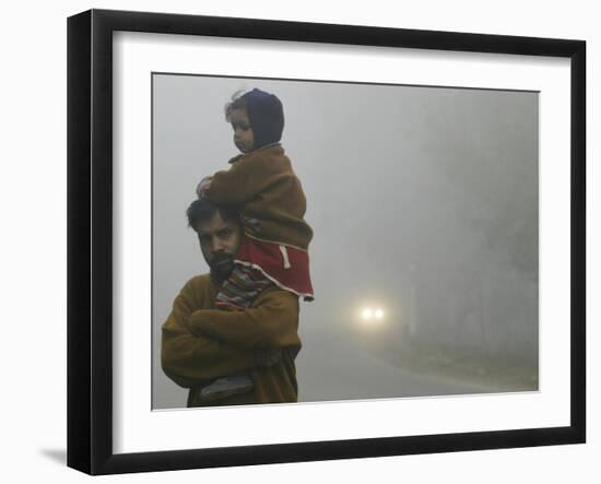 Indian Worker Carries His Daughter in the Morning Fog in the Outskirts of Jammu, India-null-Framed Photographic Print