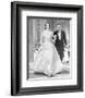 Indiscreet Woman in Dress and Man in Black Suit Walking-Movie Star News-Framed Photo