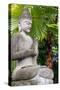 Indonesia, Bali. Buddha statue with green palms.-Cindy Miller Hopkins-Stretched Canvas