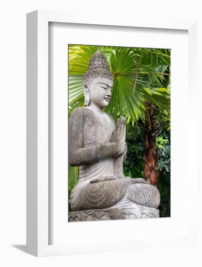 Indonesia, Bali. Buddha statue with green palms.-Cindy Miller Hopkins-Framed Photographic Print