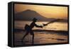 Indonesia, Bali, Silhouette of Fisherman Fishing at Sanur Beach-Dave Bartruff-Framed Stretched Canvas