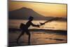 Indonesia, Bali, Silhouette of Fisherman Fishing at Sanur Beach-Dave Bartruff-Mounted Photographic Print