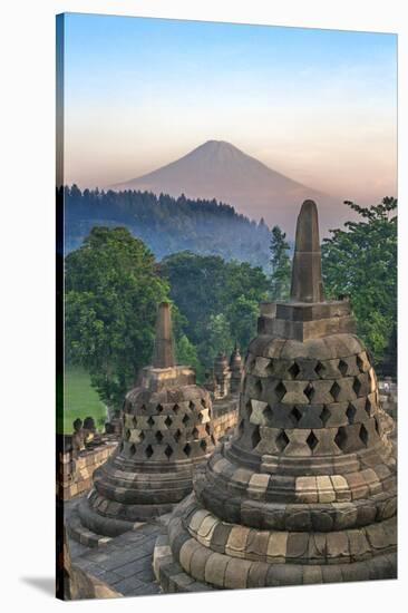 Indonesia, Java, Borobudur. Early Morning Sun Shines on the Dormant Stratovolcano-Nigel Pavitt-Stretched Canvas