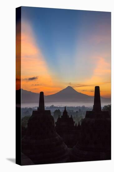 Indonesia, Java, Borobudur. Sunrise over the Active Stratovolcano-Nigel Pavitt-Stretched Canvas