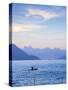 Indonesia, Sumatra, Samosir Island, Tuk Tuk, Man Fishing in Dug Out Canoe on Lake Toba-Jane Sweeney-Stretched Canvas