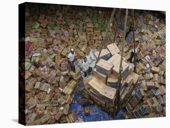 Indonesian Navy Sailors Load Boxes of Aid Bound for Banda Aceh into a Container Ship-null-Stretched Canvas