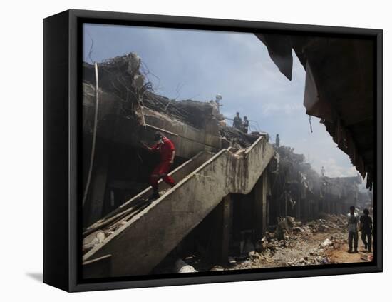 Indonesian Rescue Workers Walk on a Eartquake Damaged Building, in Padang, Indonesia-null-Framed Stretched Canvas