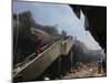 Indonesian Rescue Workers Walk on a Eartquake Damaged Building, in Padang, Indonesia-null-Mounted Photographic Print