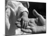 Infant's Hand in Man's Hand-Philip Gendreau-Mounted Photographic Print