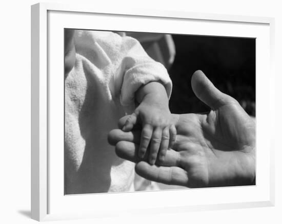 Infant's Hand in Man's Hand-Philip Gendreau-Framed Photographic Print