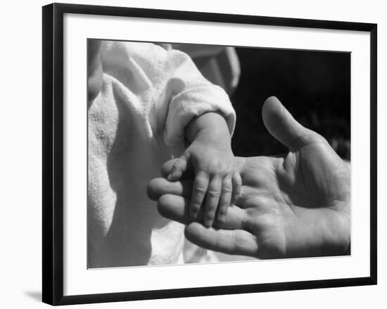 Infant's Hand in Man's Hand-Philip Gendreau-Framed Photographic Print