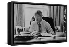 Informal Portrait of President Bill Clinton at His Desk in the Oval Office-null-Framed Stretched Canvas